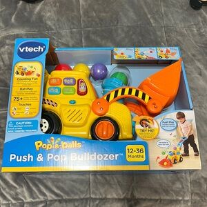 New in box push & pop bulldozer